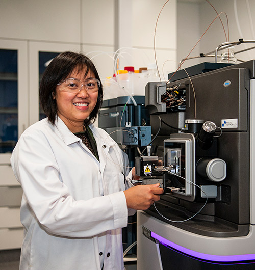 Postdoctoral researcher Dr Thu Ho with a Synapt XS native mass spectrometer